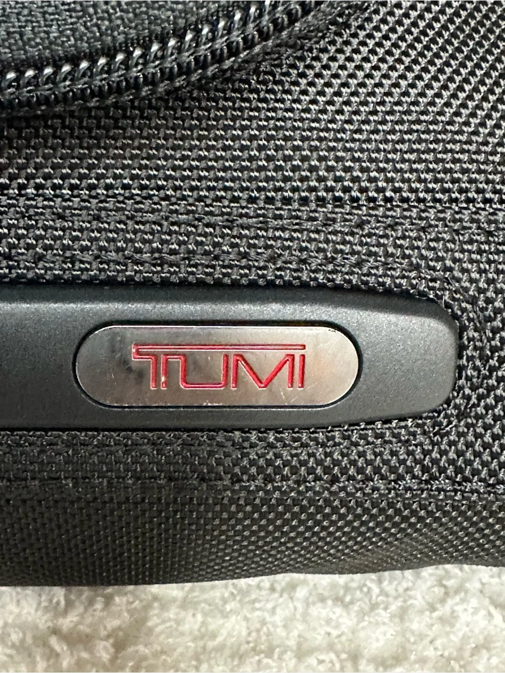 Tumi Black Toiletry Bag with Red Accents